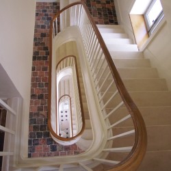 Prestigious and curved wooden custom-made stair realised for villa or luxury house